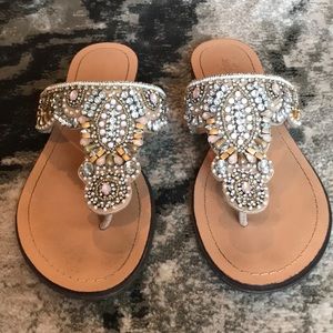 Beautifully jeweled t-strap style sandal.